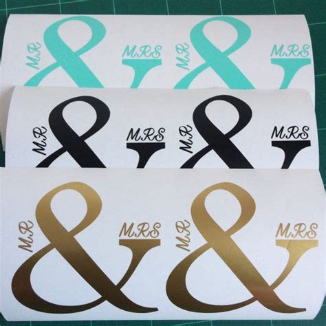 Three Stickers With The Words Mr And Mrs In Gold Black And White On Them