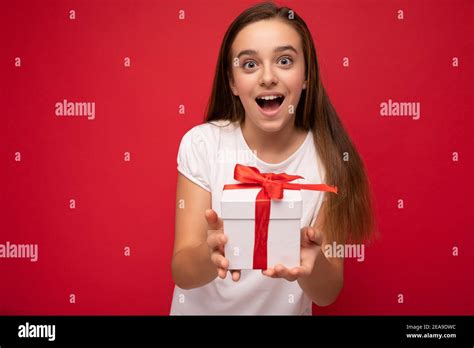 Photo Shot Of Attractive Happy Delightful Brunette Girl Isolated Over Red Background Wall