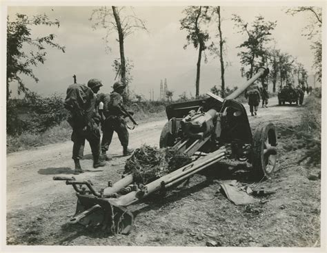 Knocked Out German 75 Mm Anti Tank Gun By The Side Of And Italian Road