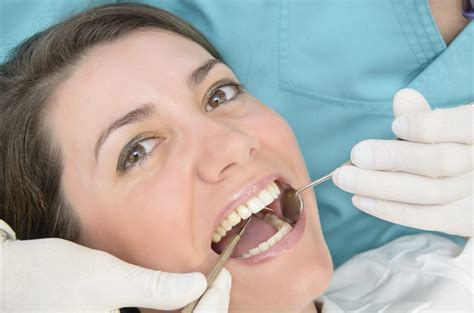 Woman Receiving Oral Cancer Screening Centre Cosmetic Dentistry Blog