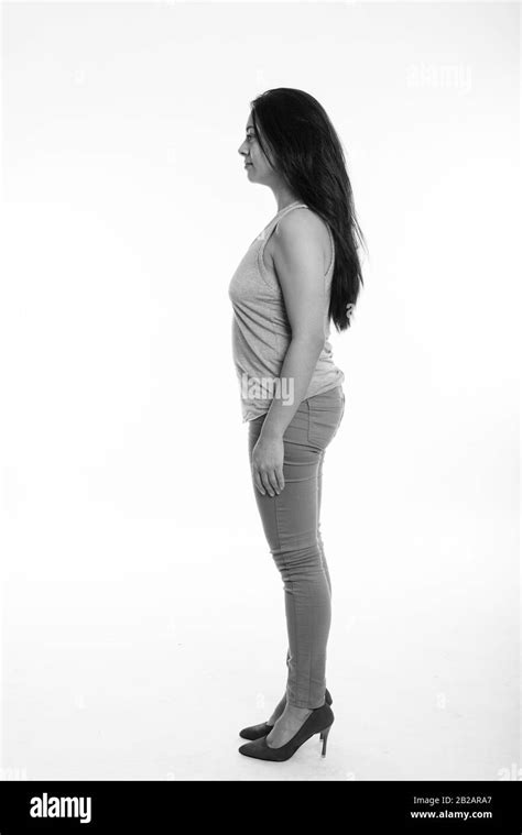 Full Body Shot Profile View Of Beautiful Woman Standing Against White