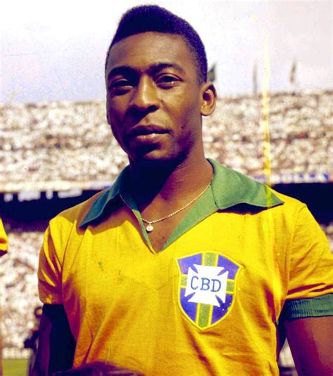 A Man In A Yellow And Green Soccer Uniform