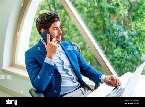 Shot Of Thinking Businessman Talking With Somebody On His Mobile Phone