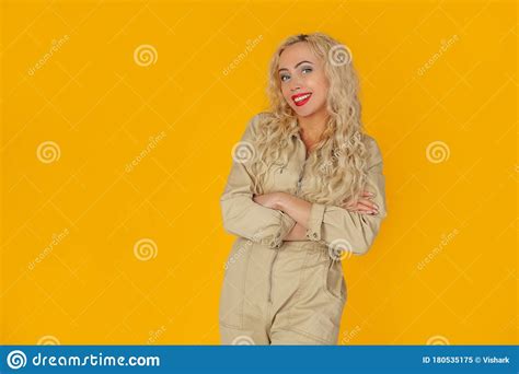 Portrait Of A Joyful And Cheerful Cute European Curly Haired Blonde