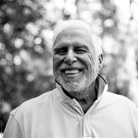 Portrait Of A Handsome Older Man Laughing By Stocksy Contributor