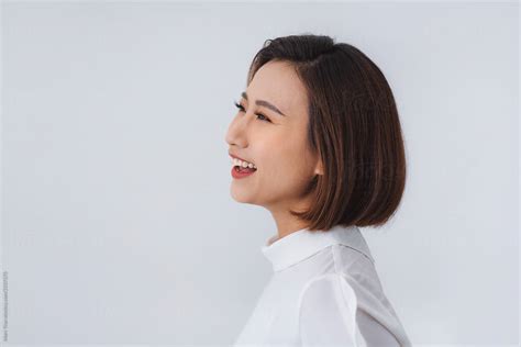Side View Profile Of Smiling Asian Woman Face Portrait By Marc Tran Stocksy United