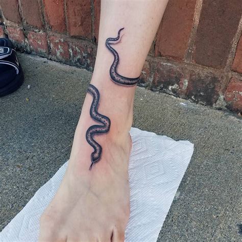When it comes to tattoo, snake tattoos are intimate and dynamic, which would bring fresh look to your body if you have right design or idea. Wrap around snake | Snake tattoo, Wrap around ankle ...