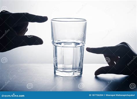 Glass Half Full Or Half Empty Stock Photography