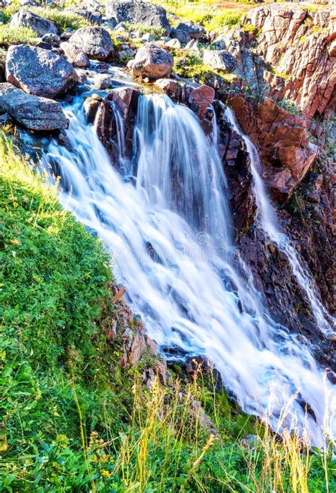 Red Rocks Waterfall Green Grass Canyon Sunny Day Stock Photo