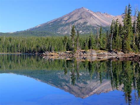 An Island And The Blue Expanse Of Summit Lake Below Waldo Lake Oregon