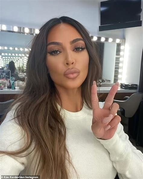 Kim Kardashian Posts A Photo With A Peace Sign Early In The Morning