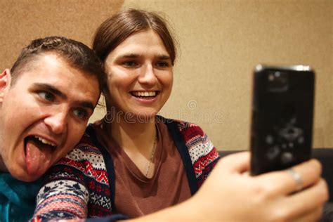 Defocus Young Man And Woman Taking Selfie Couple Or Friends Laughing Funny And Having Fun With