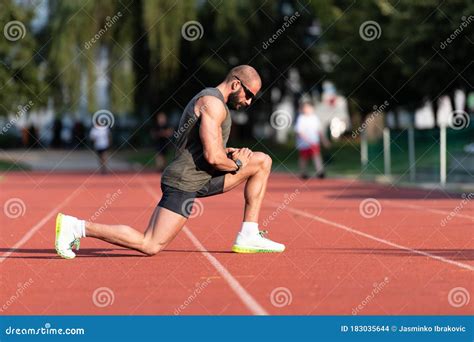 Young Fitness Man Runner Stretching Legs Before Run Stock Photo Image