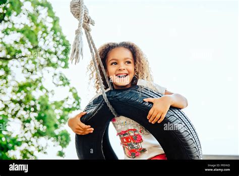 Girl Tire Swing Hi Res Stock Photography And Images Alamy