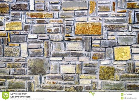 Stone Wall Of Multi Colored Stones With Decorative Masonry Stock Image