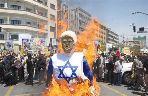 It is rooted in a dispute over land claimed by jews. Iranian protesters burn an effigy in the likeness of US ...