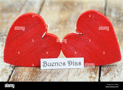 Buenos Dias Good Morning In Spanish With Two Red Wooden Hearts Stock