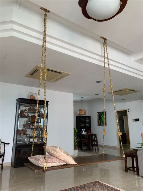 A Traditional South Indian Swing Antique Plank With A Brass Chain