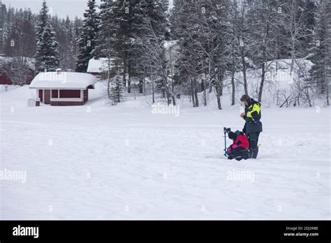Levi Lapland Finland March 6 2020 Father And Son Fishing On The