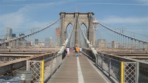 His design was approved in 1867 by new york legislatures, but he died just the bridge is about a mile long, so it shouldn't take you more than 30 minutes to walk it. My Satiable Life: WALKING THE BROOKLYN BRIDGE
