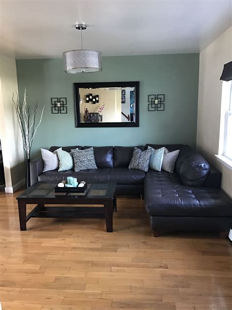 Styled with a custom gallery wall with black and look through sage green bedroom and pictures in different colors and styles and when you find some sage green bedroom. Dark brown sectional looks great with sage green accent wall | Accent walls in living room ...