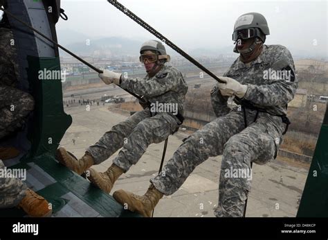 Us Army 2nd Infantry Soldiers Prepare To Rappel Off A Uh 60 Black Hawk