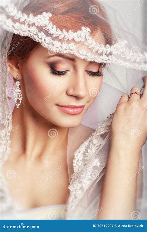 Beautiful Bride With Fashion Wedding Hairstyle On White Background