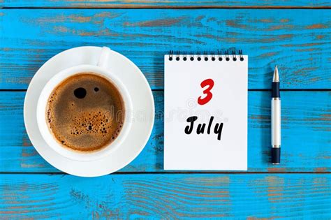 July 3rd Day Of The Month 3 Calendar On Blue Wooden Table Background