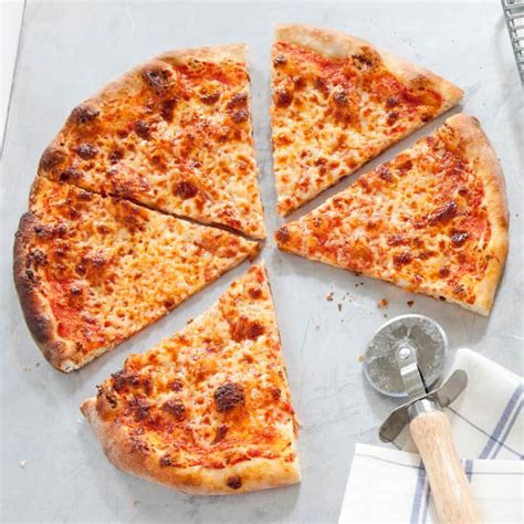 In a small mixing bowl, stir together 200 grams (a little less than 1 cup) lukewarm tap water, the yeast and the olive oil, then pour it into flour. Thin-Crust Pizza | America's Test Kitchen