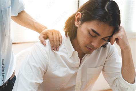Person Touching Shoulder Friend To Encouragement Stock Photo Adobe Stock