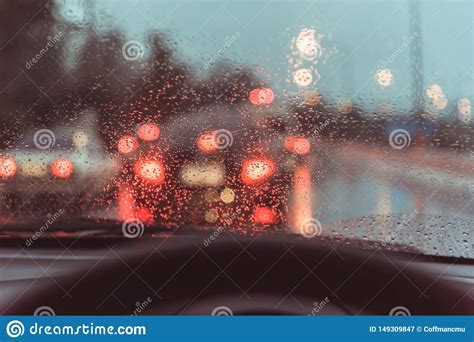 People Driving Car On Evening Time With Raindrop Stock Image - Image of raindrop, mirror: 149309847