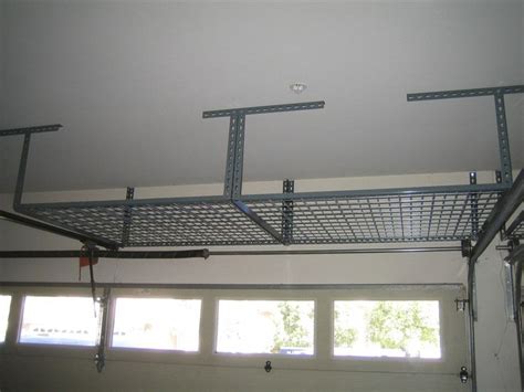 Typically, overhead storage systems measure somewhere between 4ft x 4ft and 4ft x 8ft. professional over garage door storage - Google Search ...