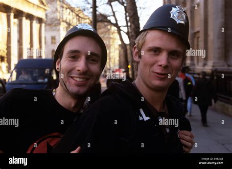 Young Men Wearing Police Hats In London Stock Photo Alamy