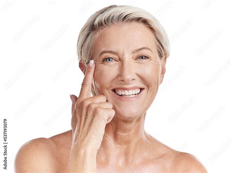 Portrait Of A Happy Smiling Mature Caucasian Woman Looking Positive And Cheerful While Posing