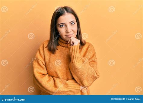 Young Beautiful Woman Wearing Turtleneck Sweater Smiling Looking