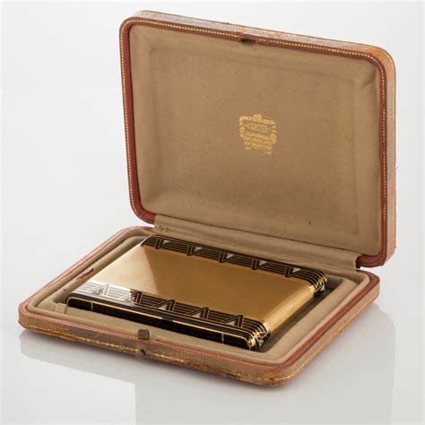 A Cartier Art Deco Cigarett Case In 18k Gold With Black Enamel And