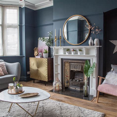 Living Room Makeover With Dark Blue Walls Pink Sofa And