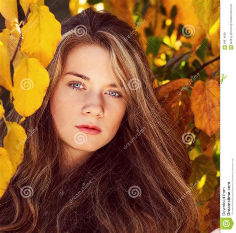 Beautiful Model With Autumn Leaves And Fall Yellow Garden Backgr Stock