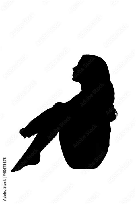 Silhouette In Shadow Of A Young Woman Sitting Sad Pensive Stock Photo