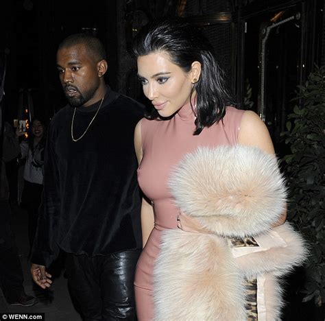 kanye west can t resist giving wife kim kardashian a cheeky feel of her bottom daily mail online