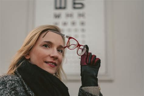 Pretty Blonde Tries On Red Rimmed Optical Glasses Stock Image Image