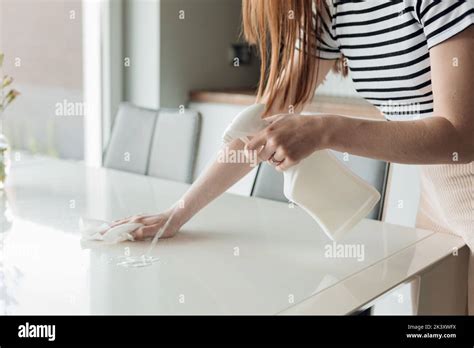unrecognizable cropped woman housewife hand do household chores cleaning apartment with