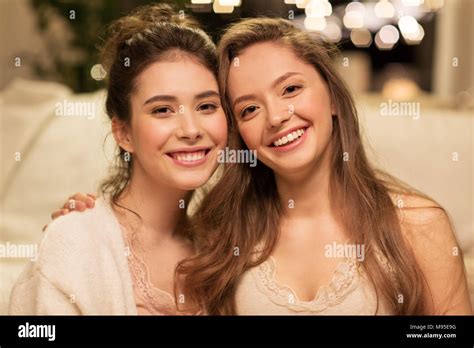 Happy Female Friends Hugging Stock Photo Alamy