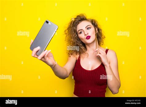 Young Beautifulgirl With An Curly Hairstyle Laughing Girl Take Selfie