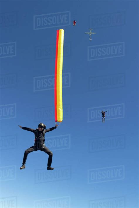 Woman Skydiving With Parachute Stock Photo Dissolve