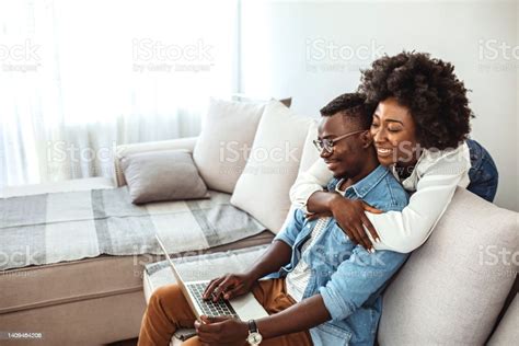 Cheerful Happy African American Young Marriage Laughing While Watching