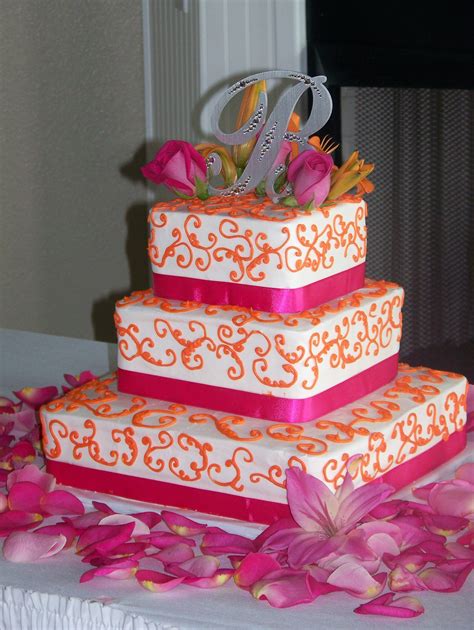 hot pink and orange love it pink orange wedding cake orange wedding flowers white wedding