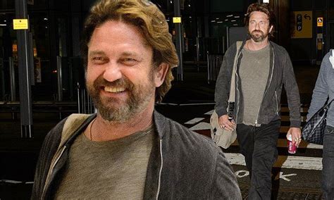 Beaming Gerard Butler Looks Fit And Well As He Touches Down In London
