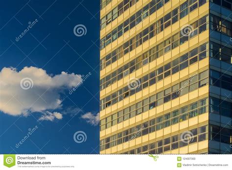 Multistorey Office Building And Cloud On Blue Sky Stock Photo Image
