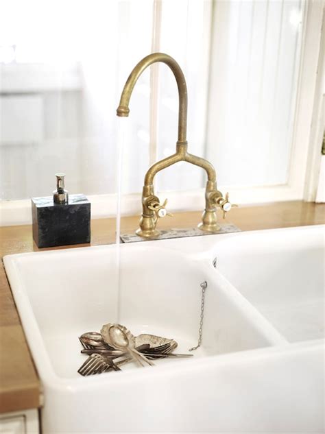 Like other types of kitchen faucets, brass faucets are available with smart features, including pull down sprayers and high arcs. Antique Brass Bridge Faucet - Eclectic - kitchen - Toby Scott